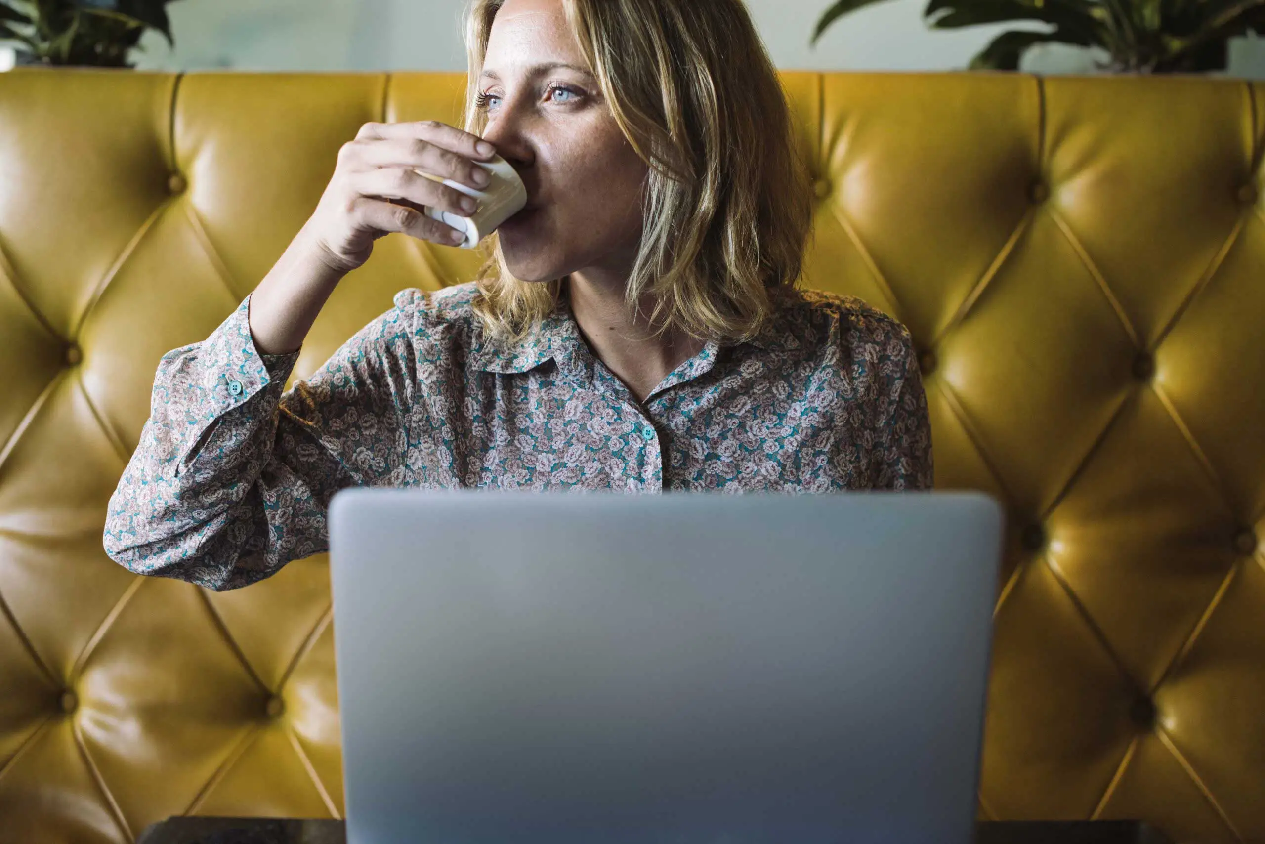 Creative person reviewing website SEO and analytics on a laptop in a modern studio workspace